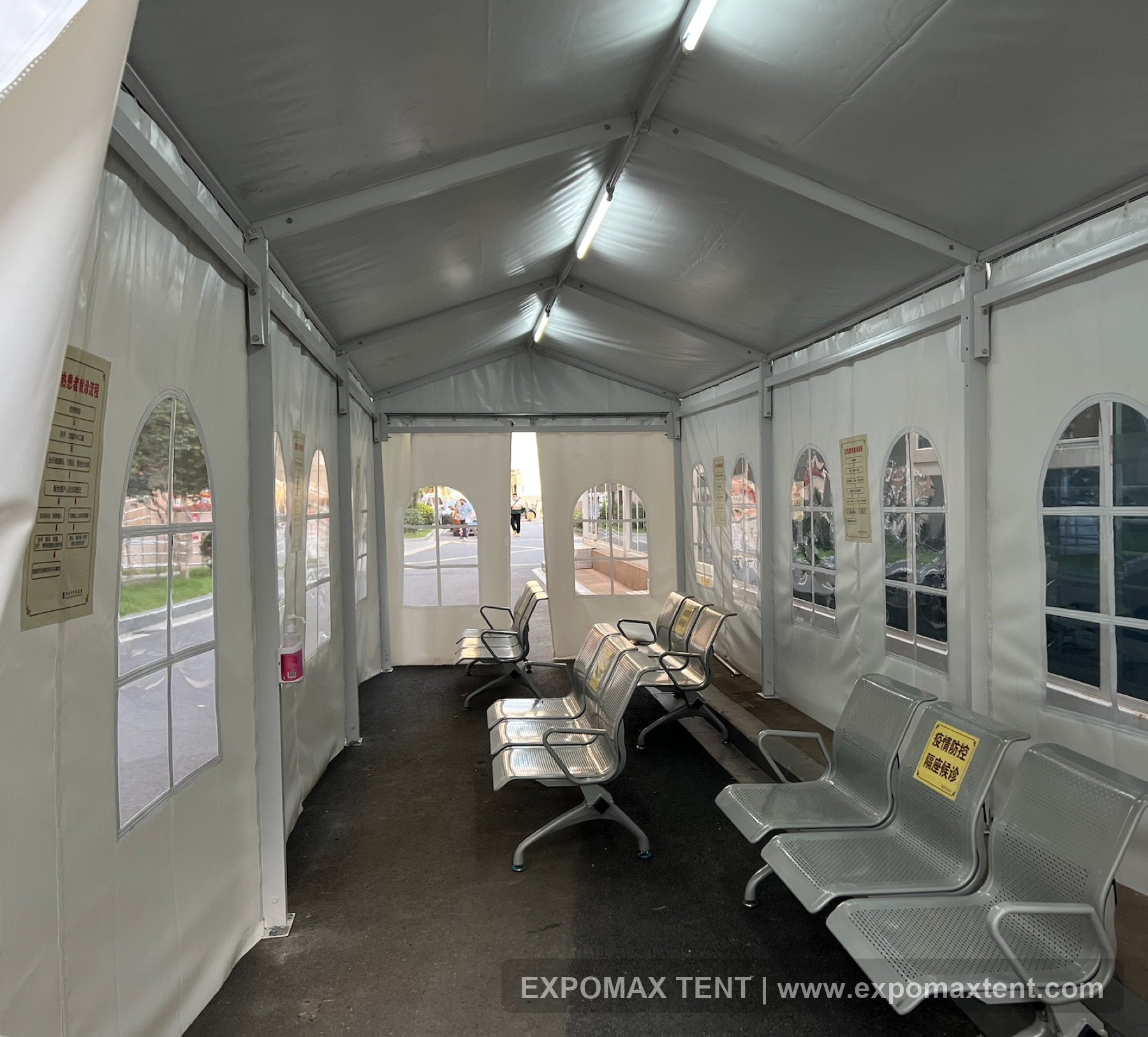 Temporary medical waiting area with seating inside a tent