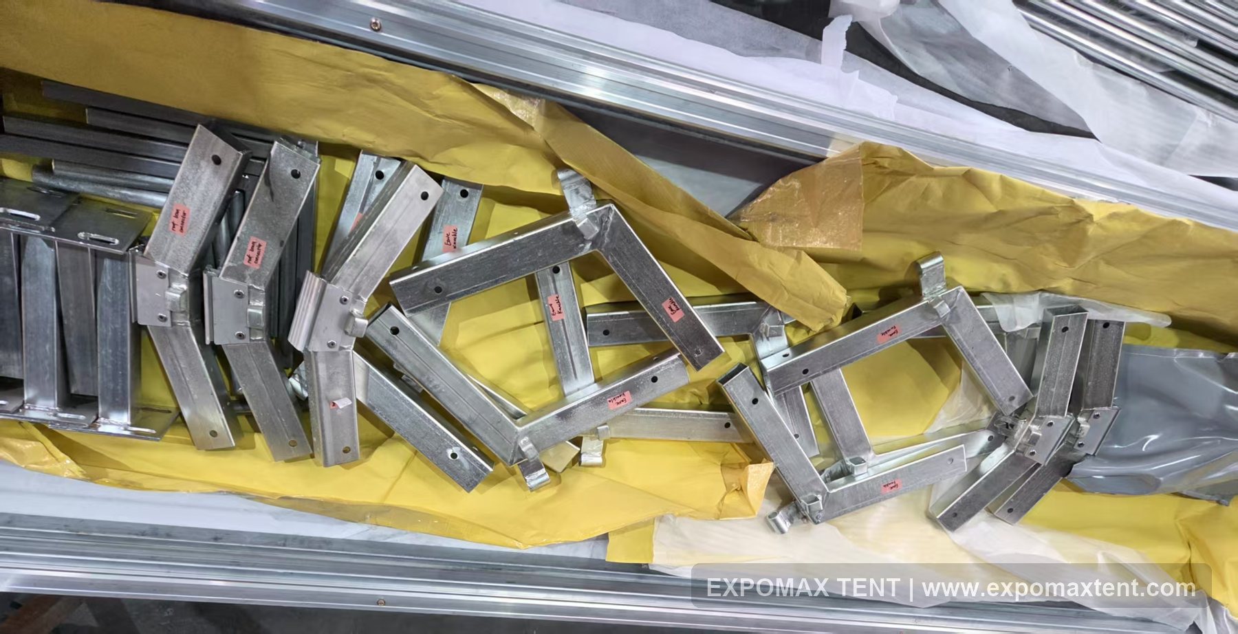 Clearly marked tent accessories and frame components for shipment checking
