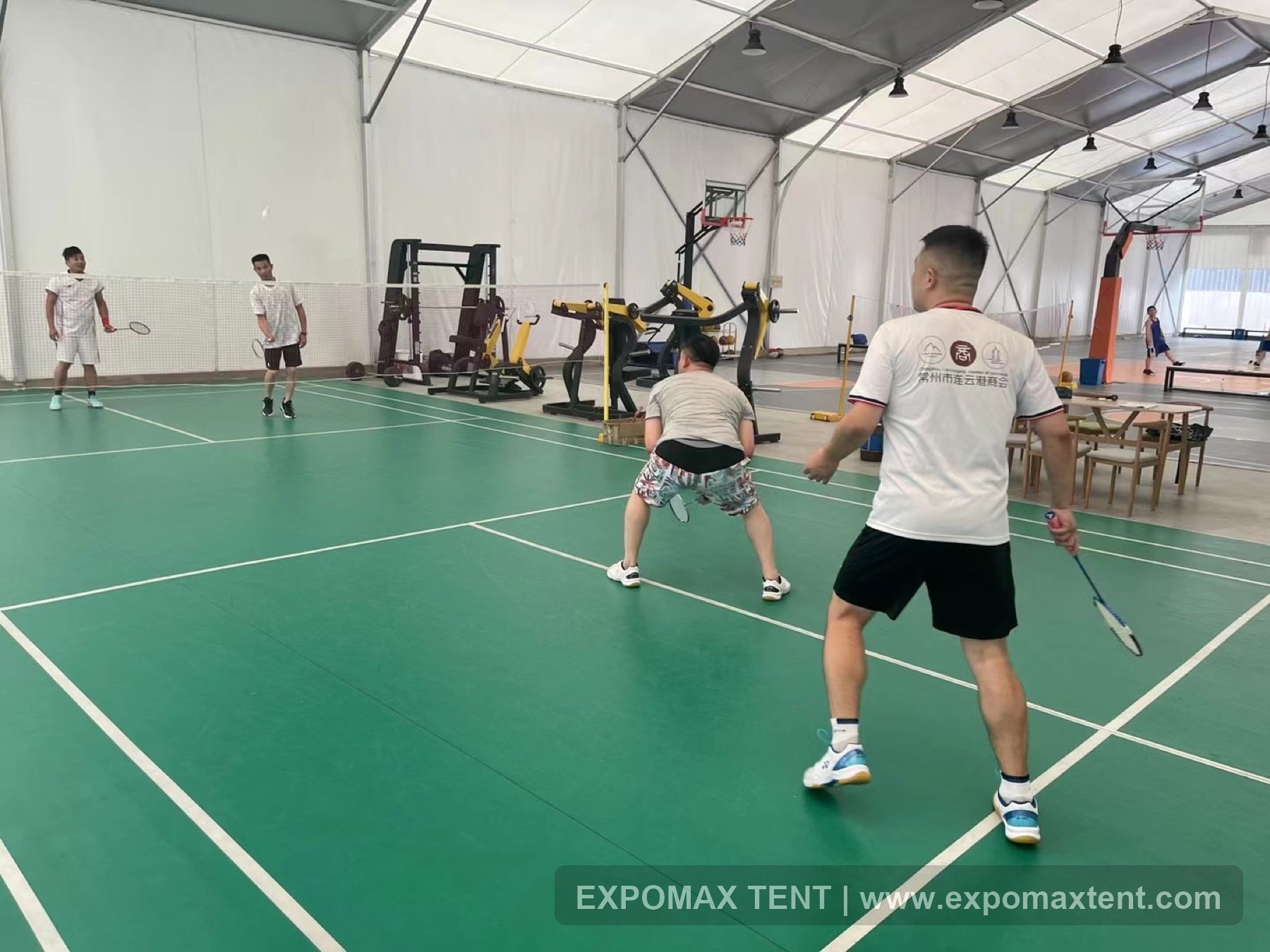 Badminton and basketball court layout inside sports tent