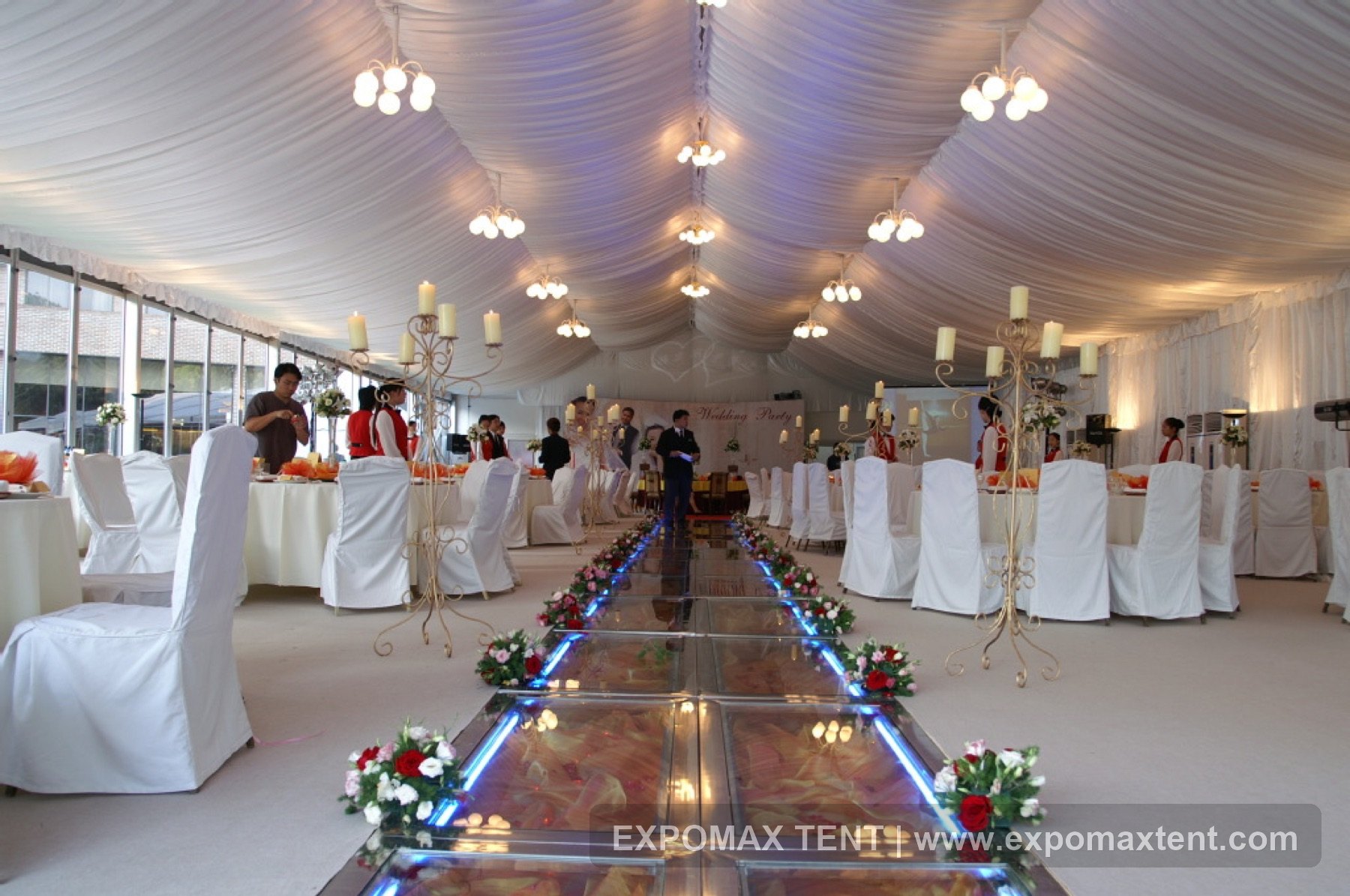 Drapery and lighting inside a wedding tent