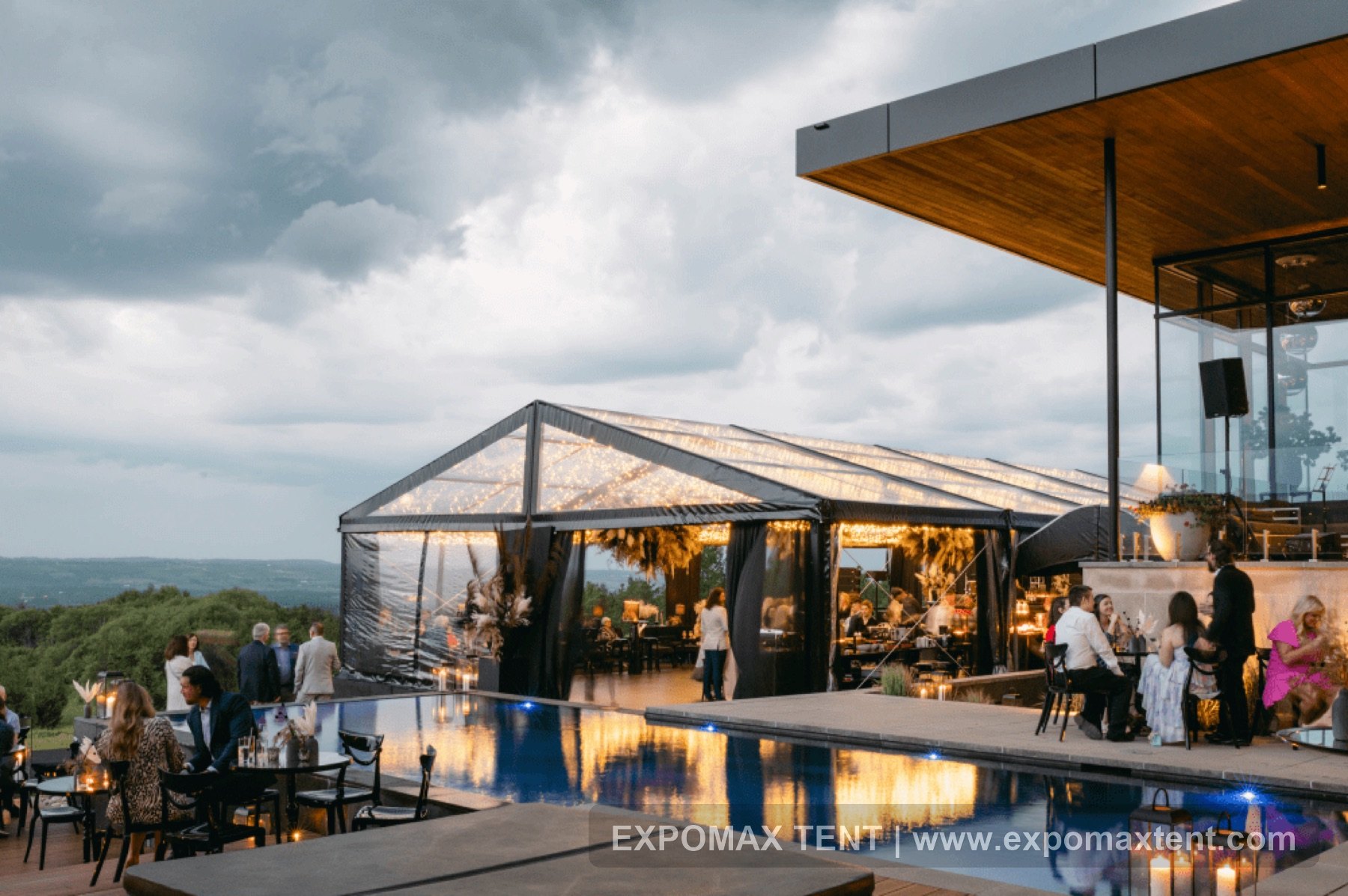 Evening party tent beside a pool